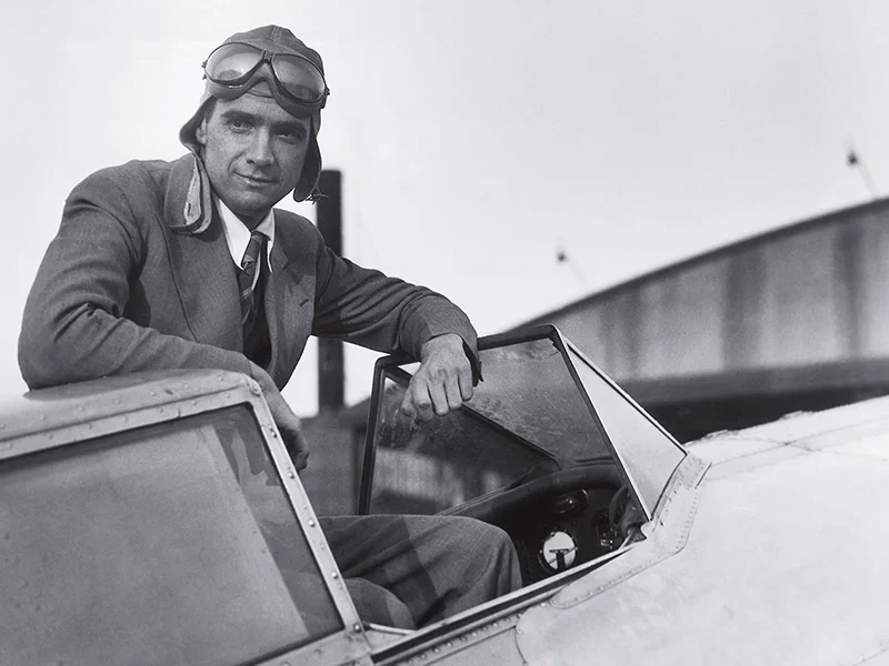 Howard Hughes in the cockpit with helmet and goggles, archive photograph