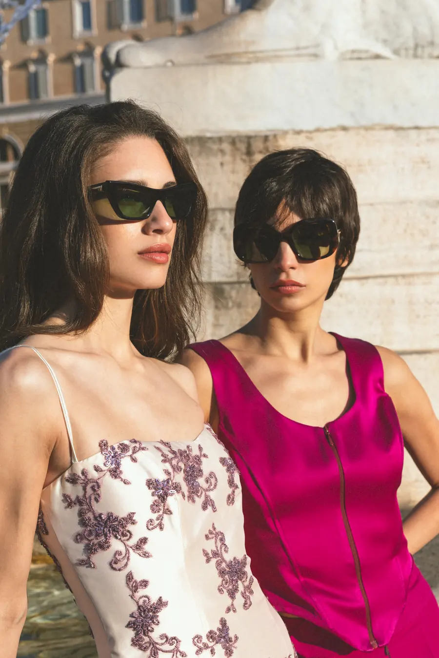 Two models in front of the fountain