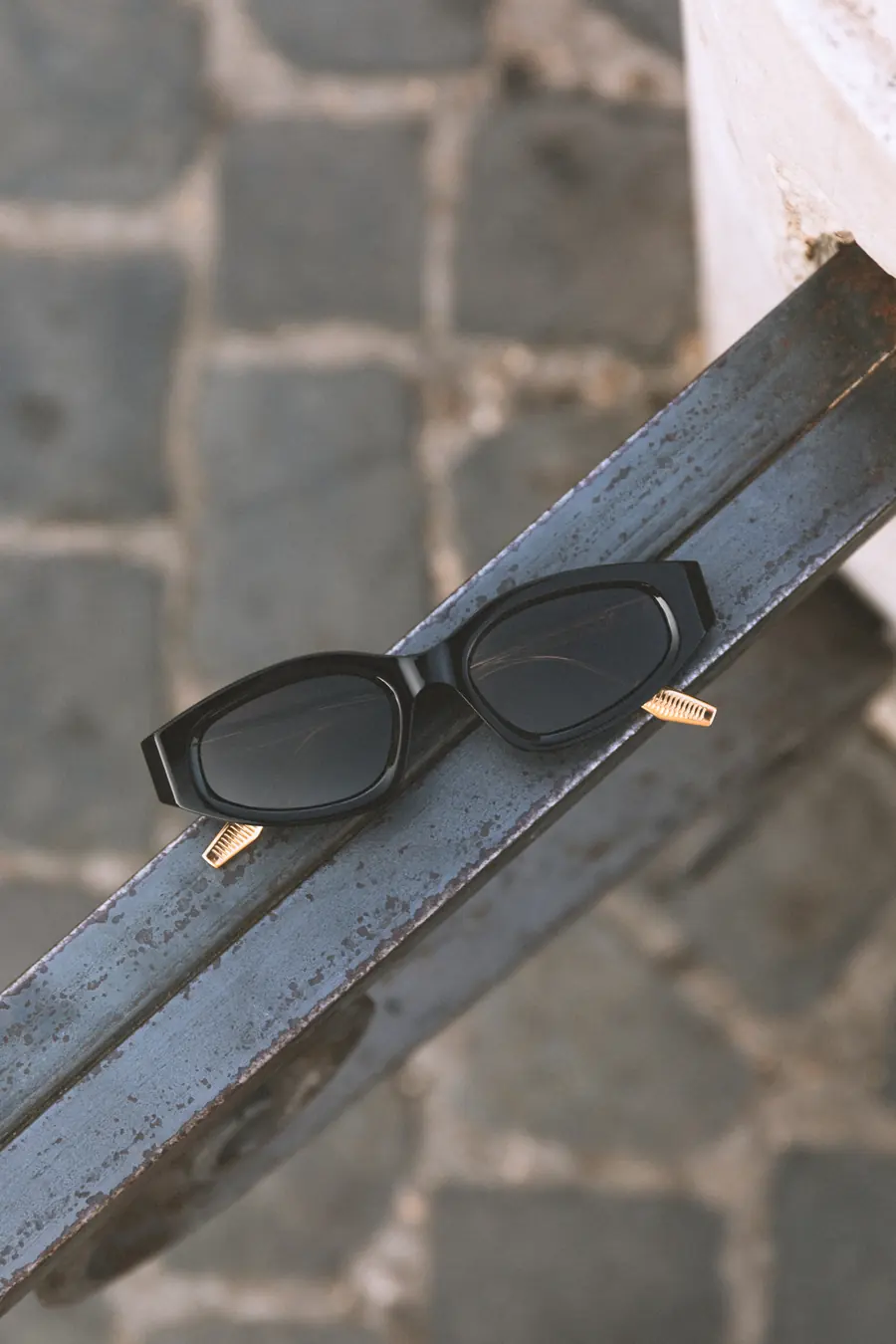 A frame resting against an iron railing