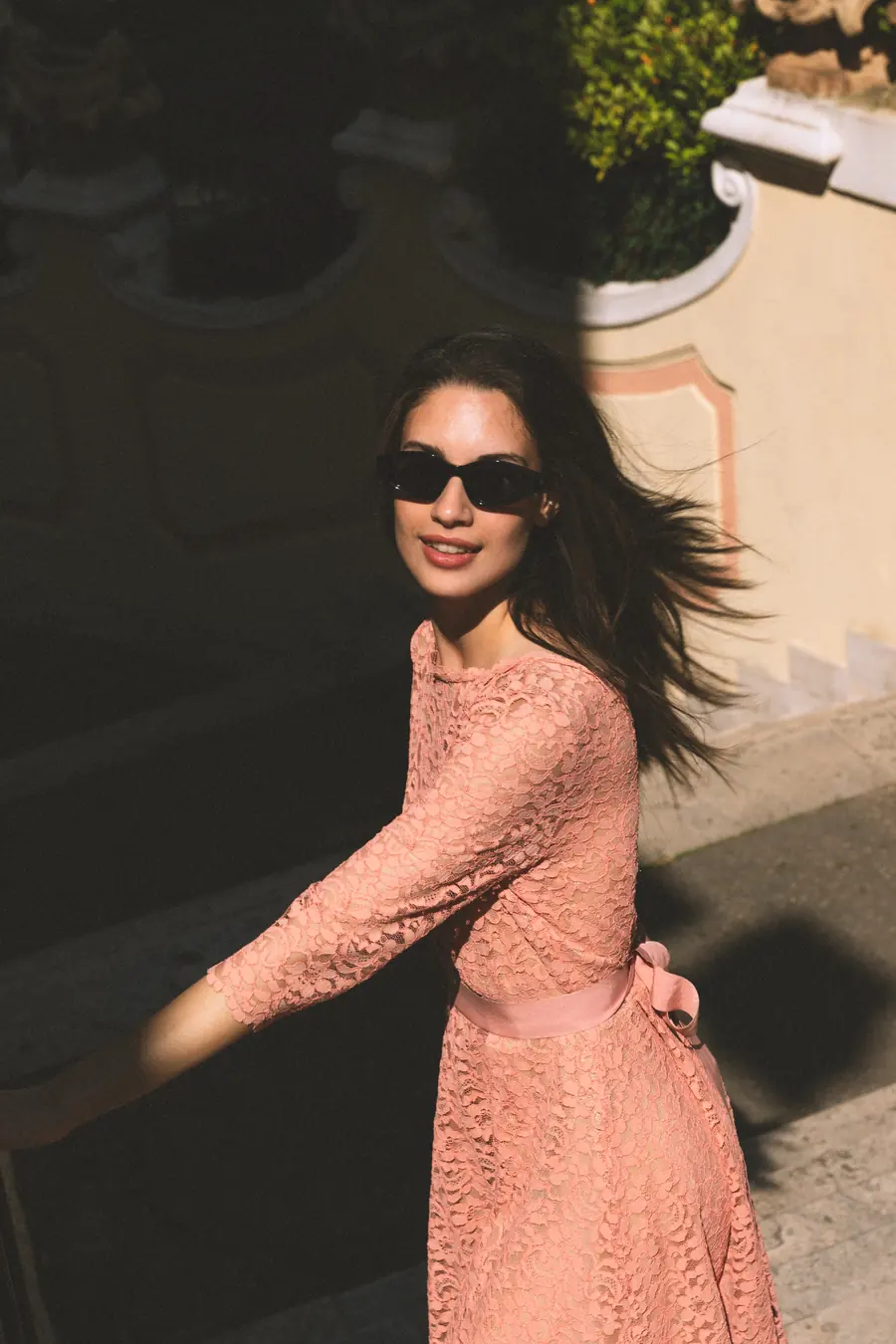 A model in motion, her dress caught by the wind